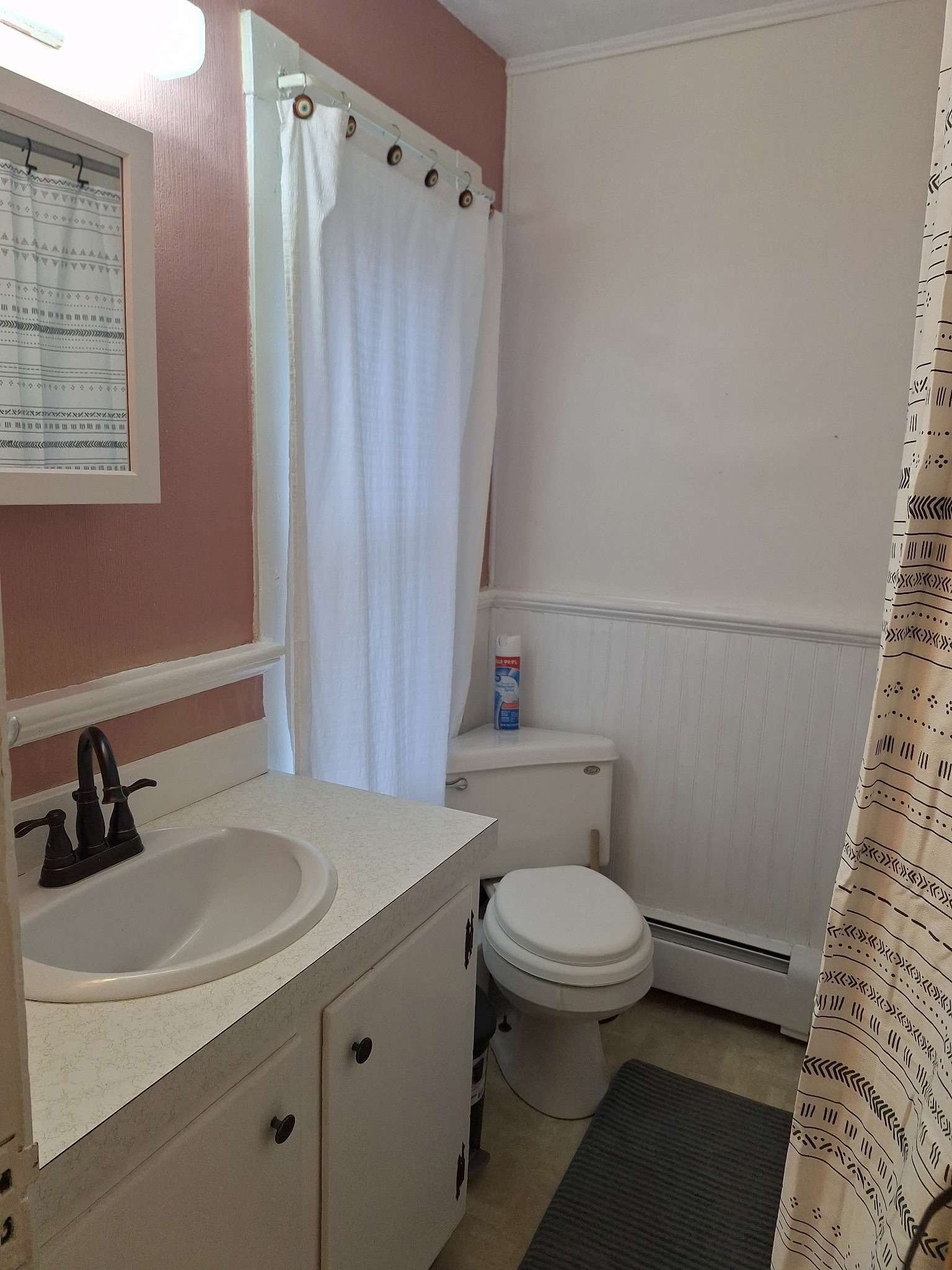 Full bathroom with shower/tub combo in Skowhegan contractor rental - clean and well-maintained
